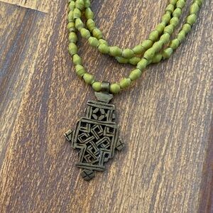 Akola necklace. Approx. 15.5” long. Yellowish/greenish color beads.